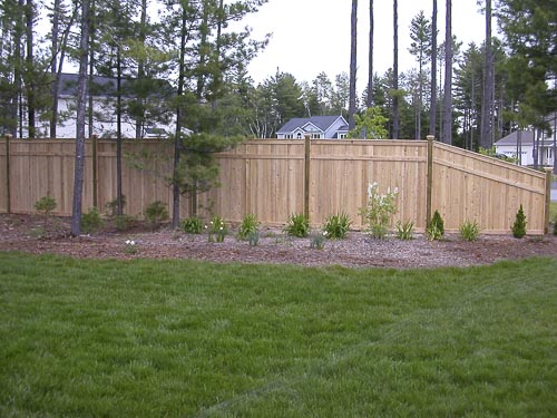 This picture shows a 6' high cedar privacy fence in a customers yard
