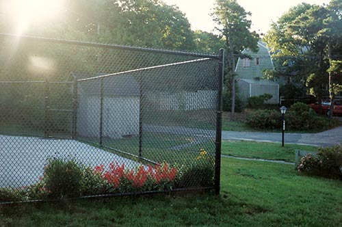 picture-of-a-6-foot-high-chain-link-fence-job in a residential neighborhood